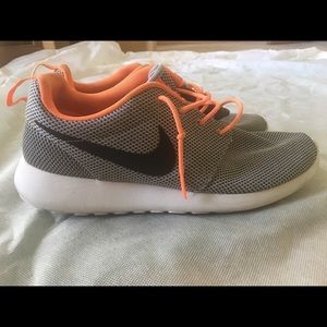 Nike orange shoes and blue, green Nike shoes